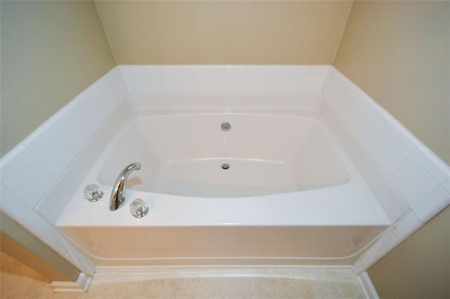 bathroom featuring a relaxing tiled tub