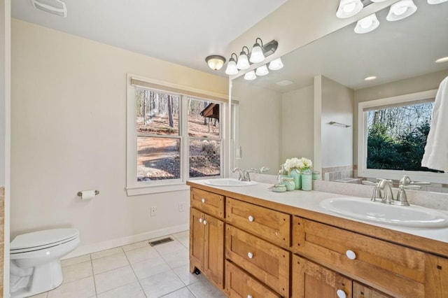 full bathroom featuring tile patterned flooring, visible vents, toilet, and a sink