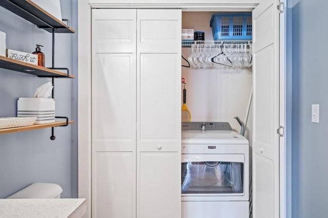 washroom featuring laundry area and washer / clothes dryer