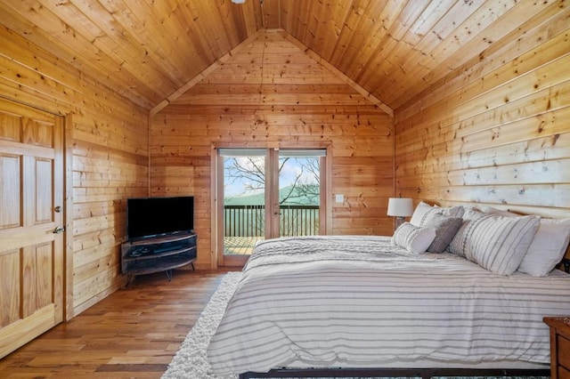 bedroom with wood ceiling, wood finished floors, wood walls, and access to outside