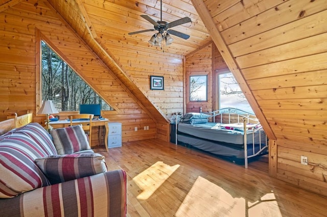 bedroom featuring vaulted ceiling, wood walls, wooden ceiling, and wood-type flooring