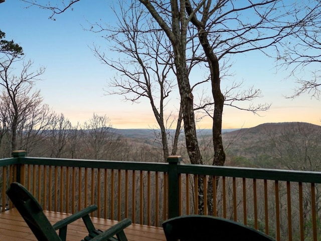 deck at dusk with a mountain view