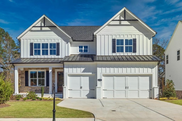 modern farmhouse style home featuring a standing seam roof, board and batten siding, and an attached garage