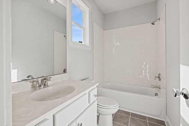 bathroom featuring vanity, bathtub / shower combination, tile patterned flooring, and toilet