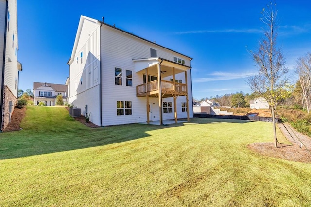 rear view of property featuring a ceiling fan, a patio area, a lawn, and central air condition unit