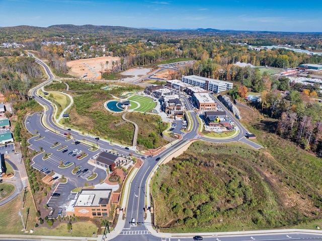 birds eye view of property with a forest view