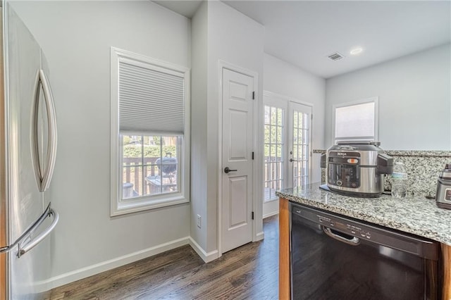 2164 Mill Garden Run, Buford, GA 30519 - kitchen featuring freestanding refrigerator, dark wood-type flooring, visible vents, a healthy amount of sunlight, and dishwasher