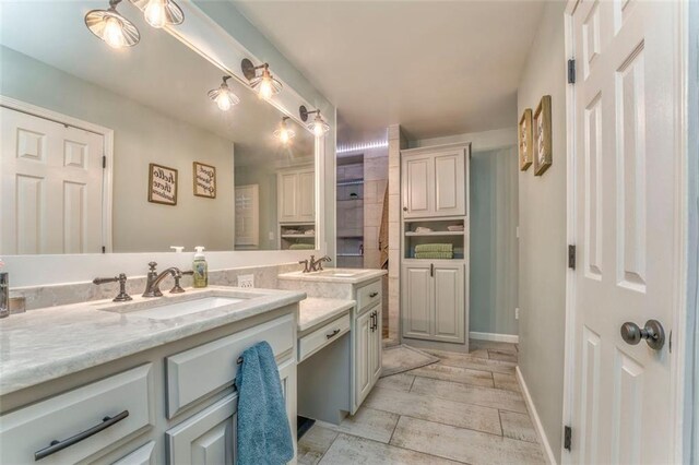 bathroom featuring vanity and baseboards