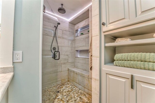 bathroom featuring a shower stall