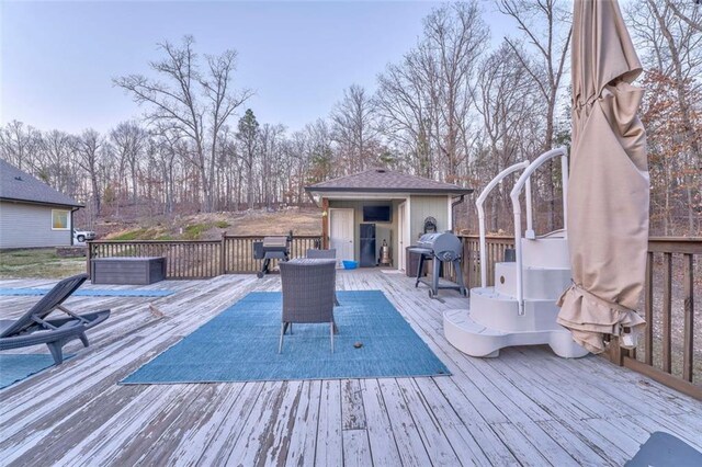 wooden deck with area for grilling