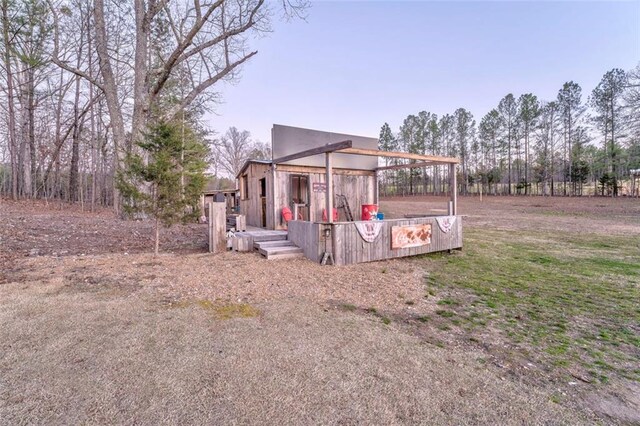 exterior space with stucco siding and a deck