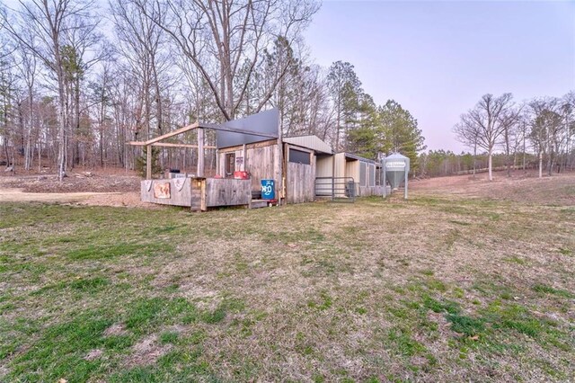 view of yard with an outbuilding and a pole building