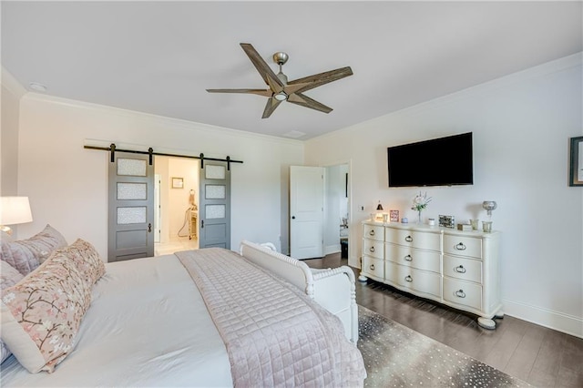 4578 Big Rock Ridge Trl, Gainesville, GA 30504 - bedroom with a barn door, wood finished floors, crown molding, ceiling fan, and ensuite bath