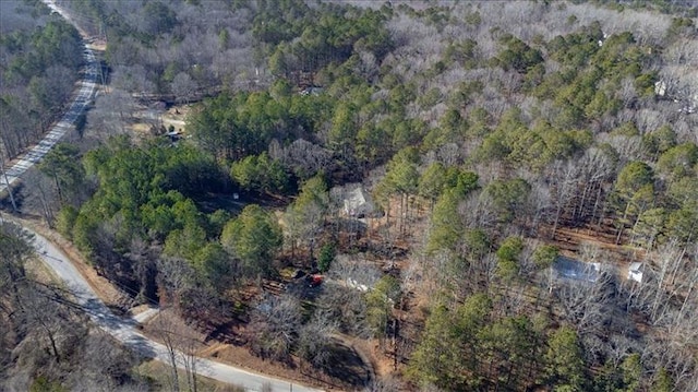 birds eye view of property with a wooded view