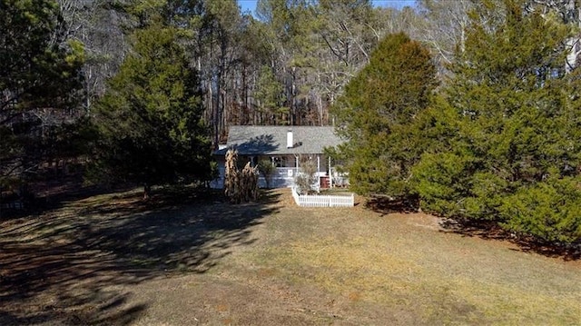 exterior space with a wooded view