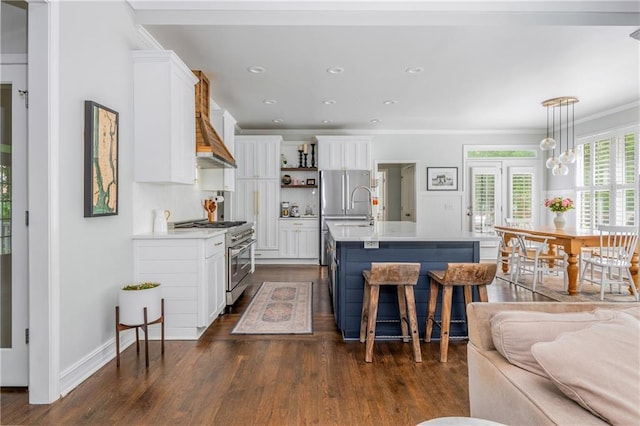 kitchen with high end range, white cabinets, dark wood-type flooring, light countertops, and recessed lighting