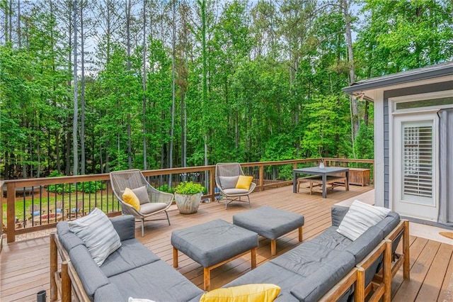 wooden terrace with outdoor dining area