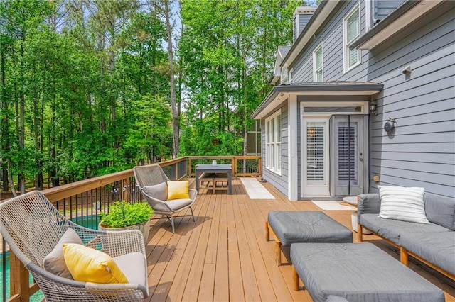 wooden deck with an outdoor hangout area