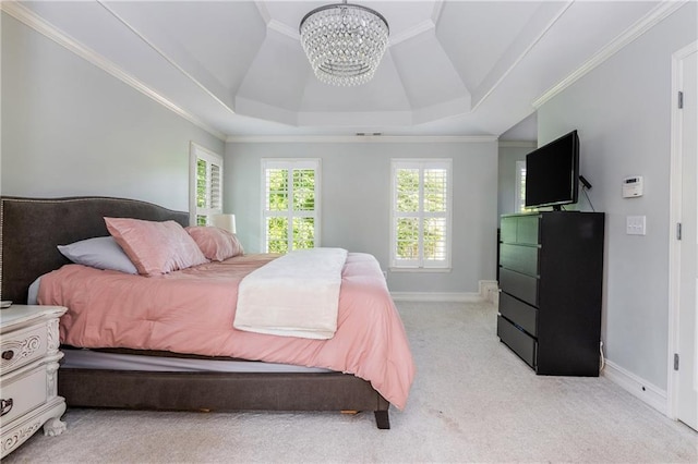bedroom with a chandelier, light colored carpet, a tray ceiling, ornamental molding, and baseboards
