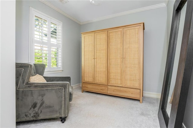 living area featuring carpet floors, crown molding, and baseboards