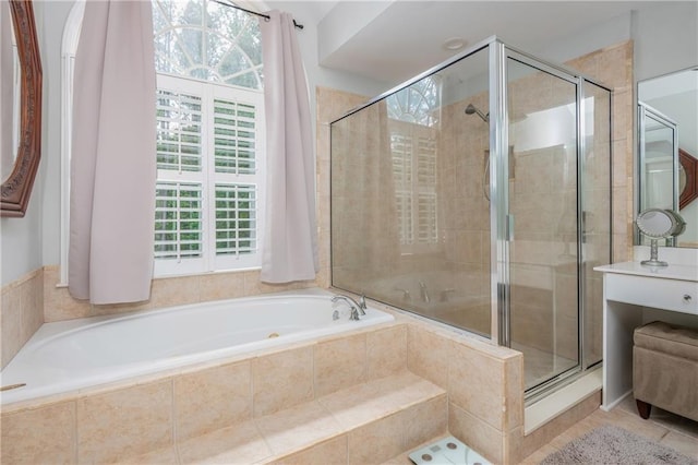 full bath with a shower stall, a garden tub, and tile patterned flooring