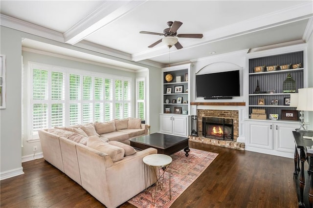 living area featuring healthy amount of natural light, dark wood finished floors, a ceiling fan, ornamental molding, and beam ceiling
