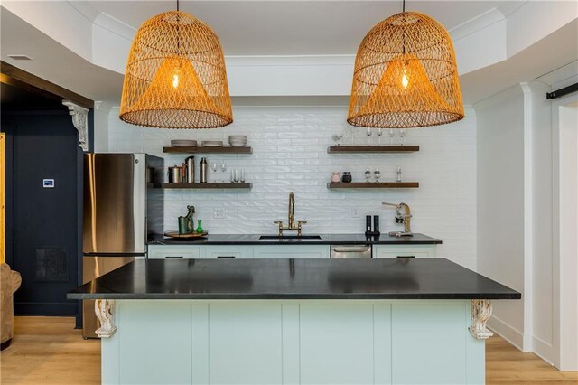 kitchen featuring a sink, open shelves, dark countertops, tasteful backsplash, and appliances with stainless steel finishes