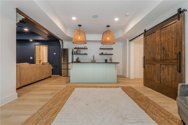 reception featuring a barn door, recessed lighting, and bar