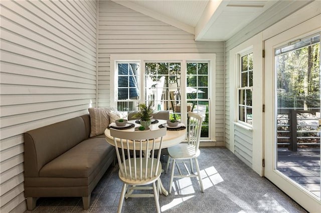 sunroom / solarium with lofted ceiling