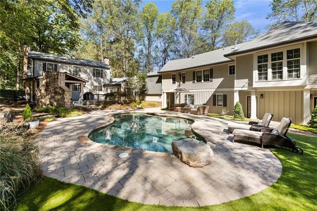 view of swimming pool with a patio area