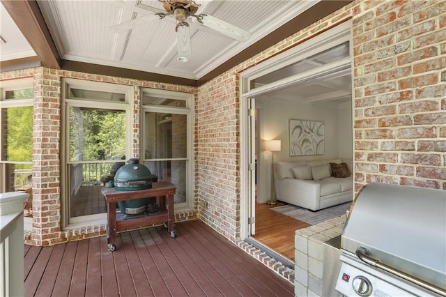 sunroom / solarium with a ceiling fan