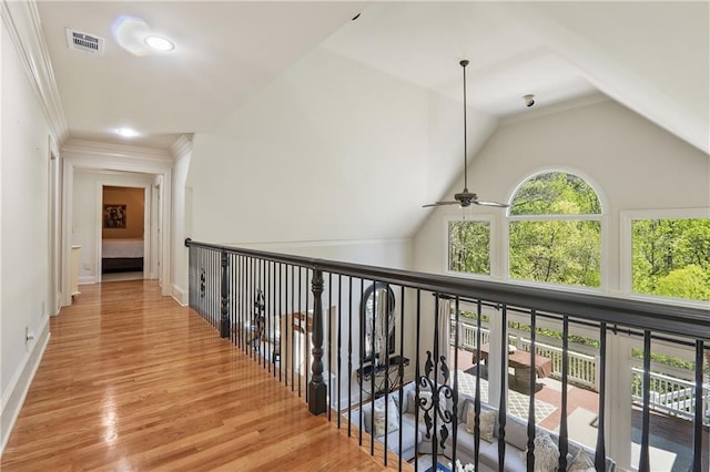corridor with vaulted ceiling, baseboards, visible vents, recessed lighting, and wood finished floors