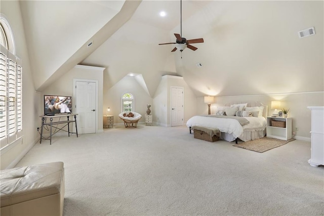 bedroom with vaulted ceiling, visible vents, and carpet