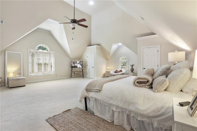 bedroom with ceiling fan, lofted ceiling, carpet flooring, and visible vents