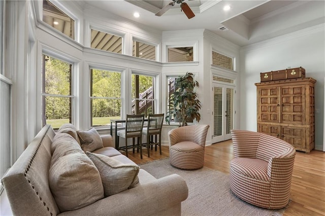 sunroom / solarium featuring french doors