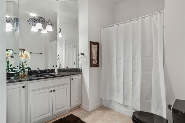 full bathroom featuring tile patterned floors, vanity, ornamental molding, and shower / bathtub combination with curtain