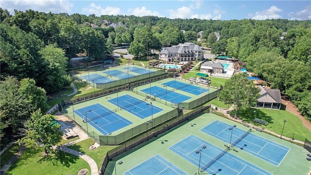 aerial view featuring a wooded view