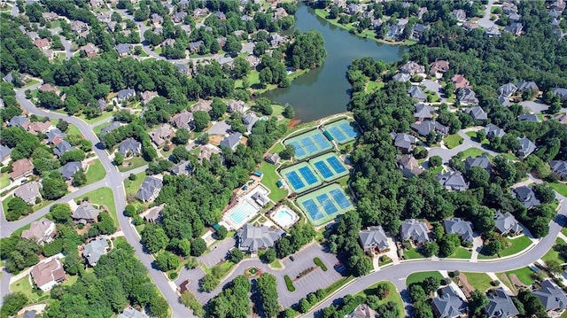 birds eye view of property with a residential view and a water view
