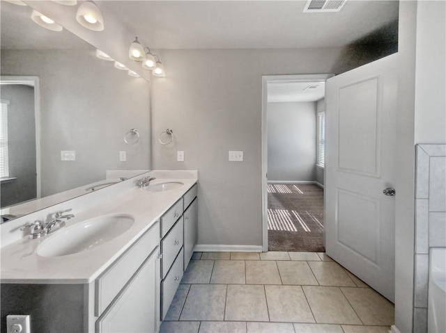 bathroom with vanity and tile patterned floors