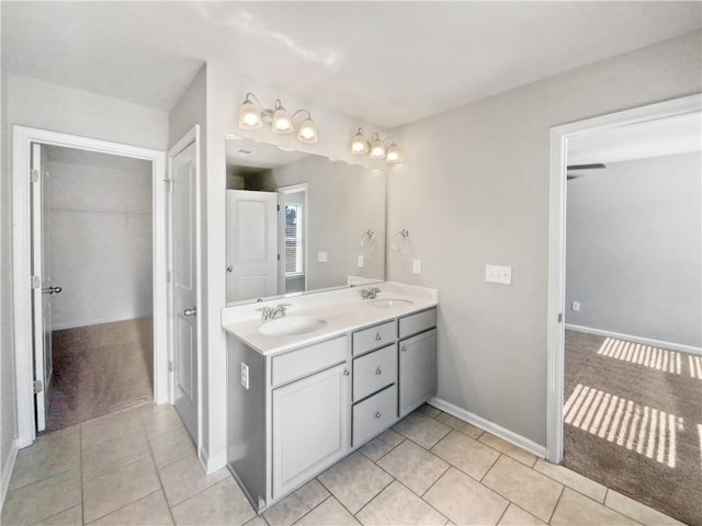 bathroom with tile patterned flooring and vanity