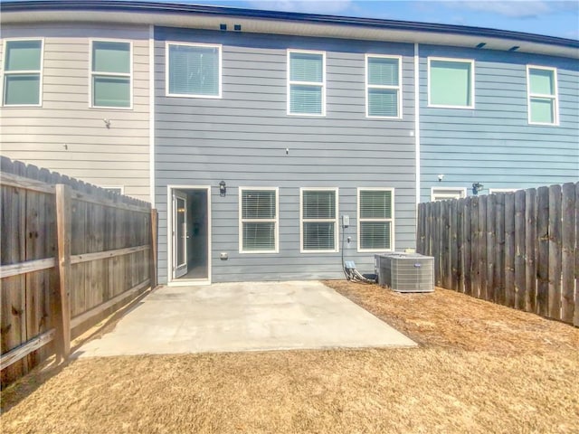 back of house featuring central AC and a patio area