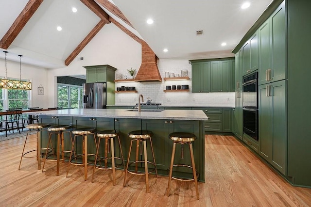 kitchen featuring pendant lighting, sink, custom range hood, beamed ceiling, and stainless steel fridge with ice dispenser