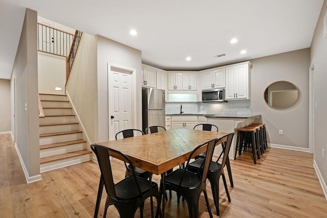 dining room featuring light hardwood / wood-style floors