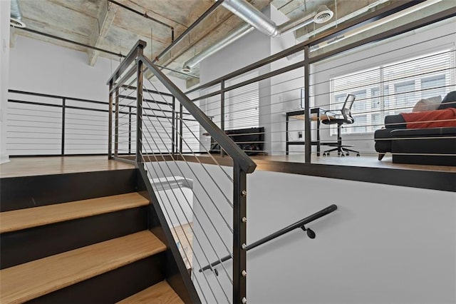 stairs with wood-type flooring