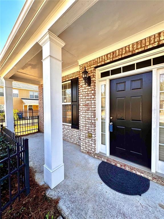 doorway to property with a porch