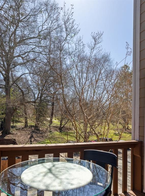 wooden terrace with outdoor dining space