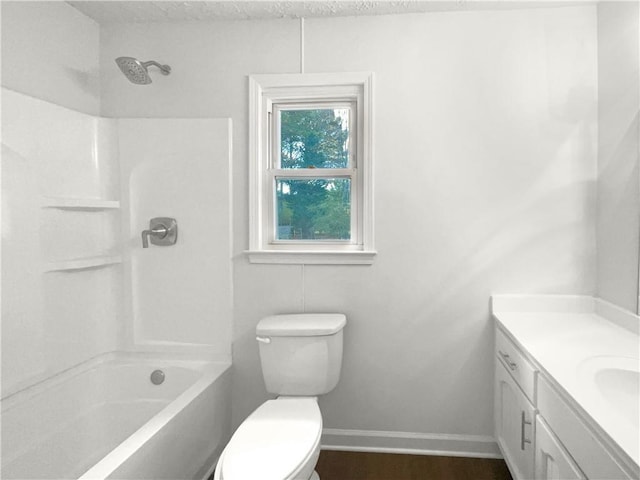 full bathroom with bathtub / shower combination, a textured ceiling, vanity, and toilet