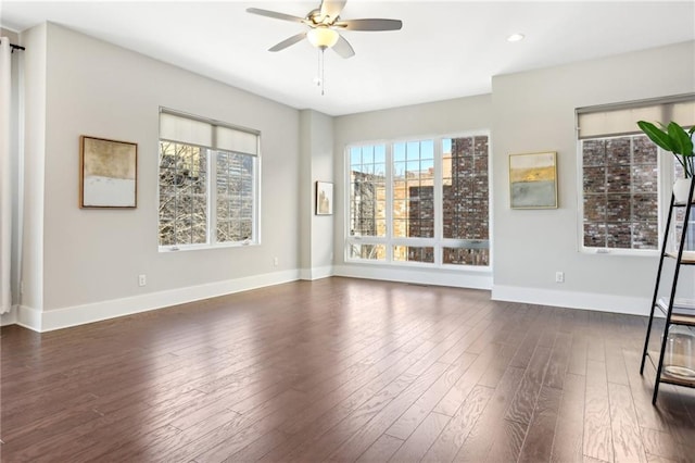 264 Castleberry Station Dr SW, Atlanta, GA 30313 - interior space with a healthy amount of sunlight, a ceiling fan, baseboards, and dark wood-style flooring