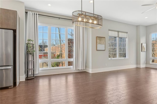 264 Castleberry Station Dr SW, Atlanta, GA 30313 - unfurnished dining area with dark wood-style flooring, recessed lighting, a ceiling fan, and baseboards
