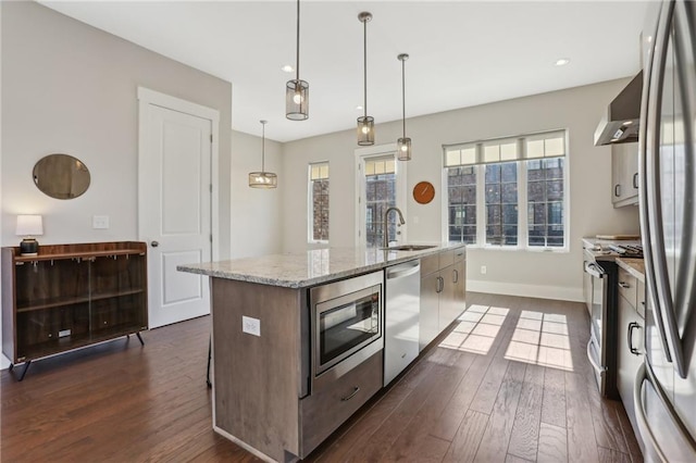 264 Castleberry Station Dr SW, Atlanta, GA 30313 - kitchen featuring dark wood-style floors, wall chimney exhaust hood, a kitchen island with sink, stainless steel appliances, and a sink